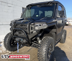 Pre-cut Polaris Xpedition ADV tint kit — door + bed cap pieces laid out
