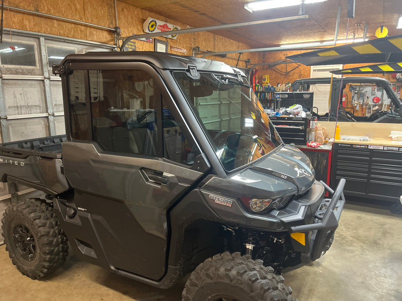 Can-Am Defender HD10 window tint — driver side door close-up