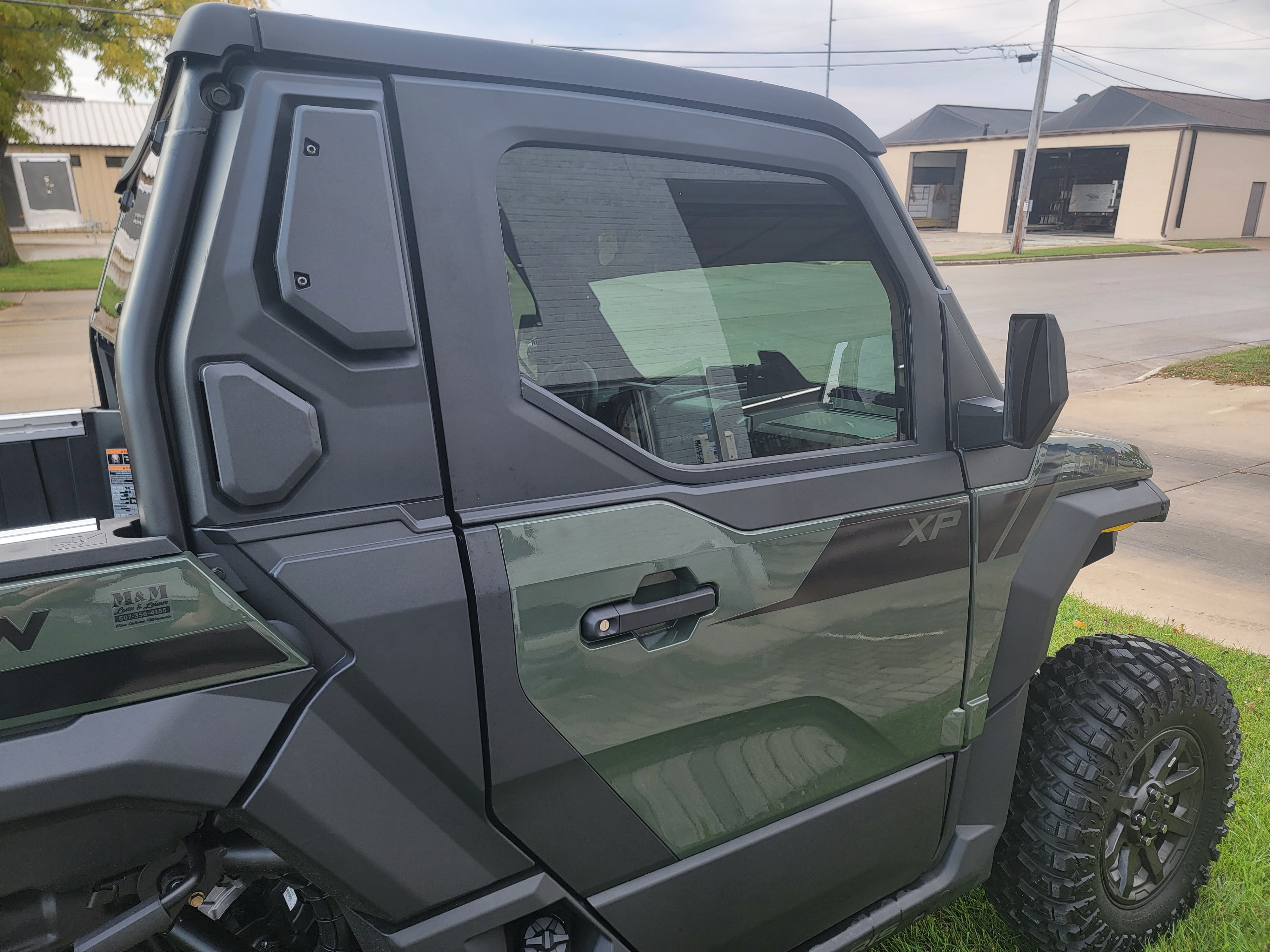 Polaris Xpedition XP window tint — driver side door close-up