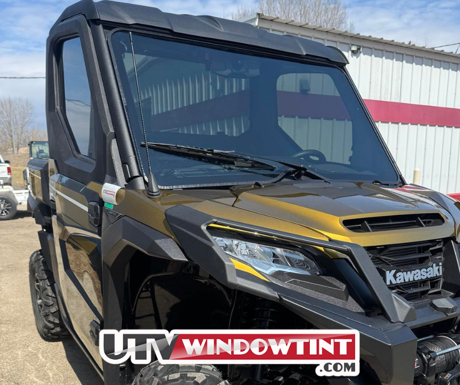 Pre-cut Kawasaki Ridge windshield tint — precision-cut film piece