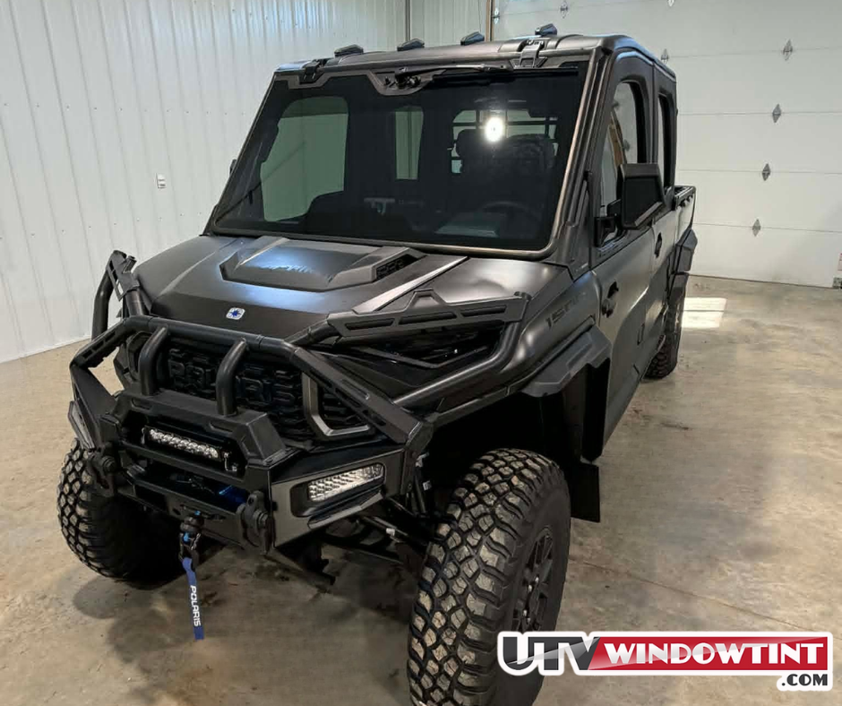 
Polaris Ranger 1500 XD front view with 35% ceramic window tint and UTVwindowtint.com banner displayed in white shop